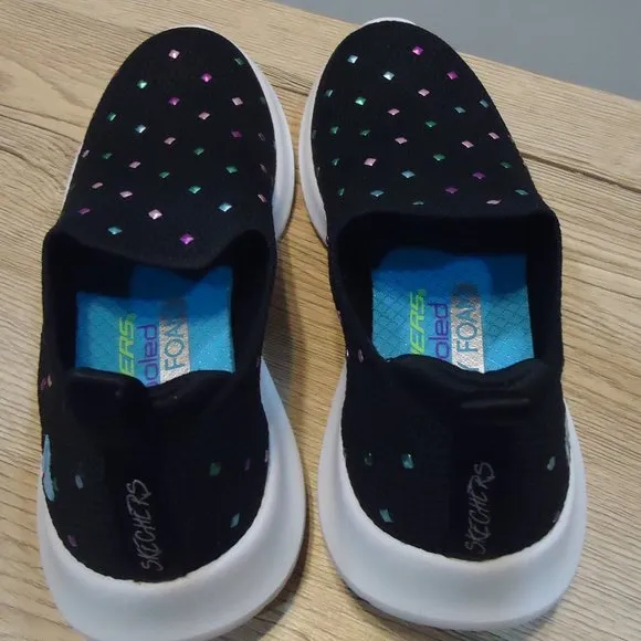 SIZE 12. Skechers air-cooled memory foam slip-on sneakers.